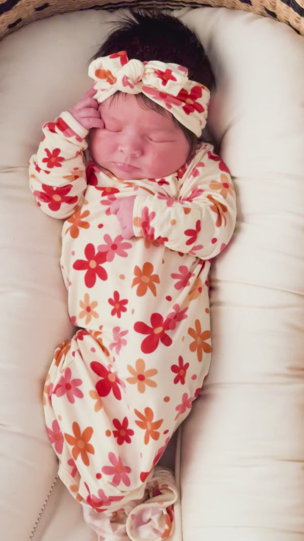Three Little Tots Flower 70s knotted newborn baby gown is ultra soft and the perfect gift for a newborn baby