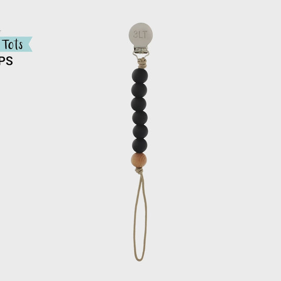 Made in the USA, Three Little Tots Paci clips feature 6 silicone beads and a secure wooden bead.