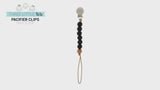 Made in the USA, Three Little Tots Paci clips feature 6 silicone beads and a secure wooden bead.