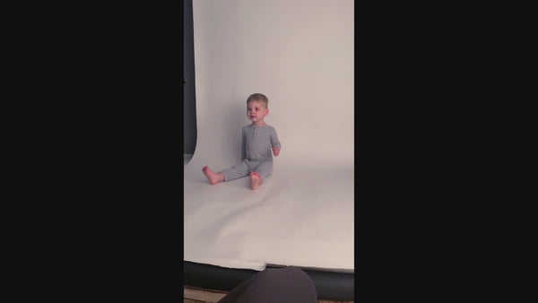 Stylish and functional, our ribbed organic cotton long-sleeve onesie features leg snaps and buttons for easy changes.