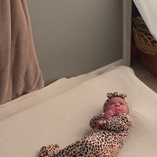 photoshoot for the Three Little Tots Leopard Knotted Baby Gown