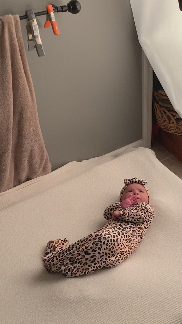 photoshoot for the Three Little Tots Leopard Knotted Baby Gown
