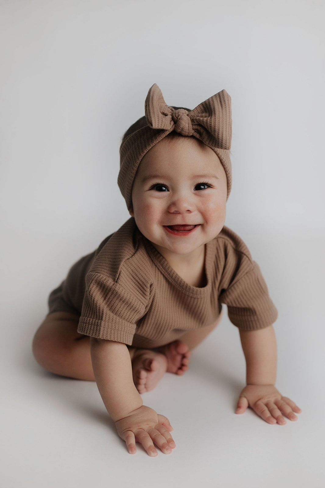 Pamper your little one in this irresistibly cute two-piece set that everyone will love! With matching headband bow