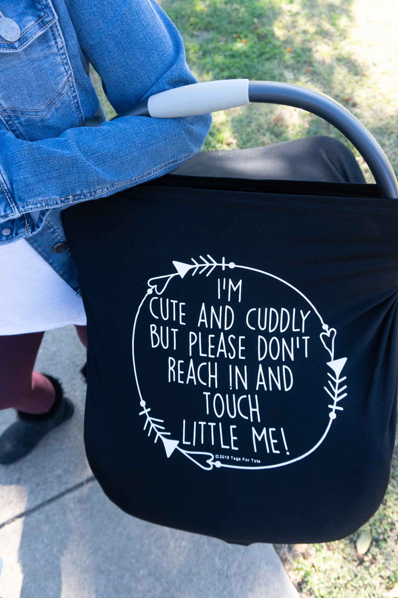 Politely keep strangers' hands away from your baby with these adorable and functional car seat covers.