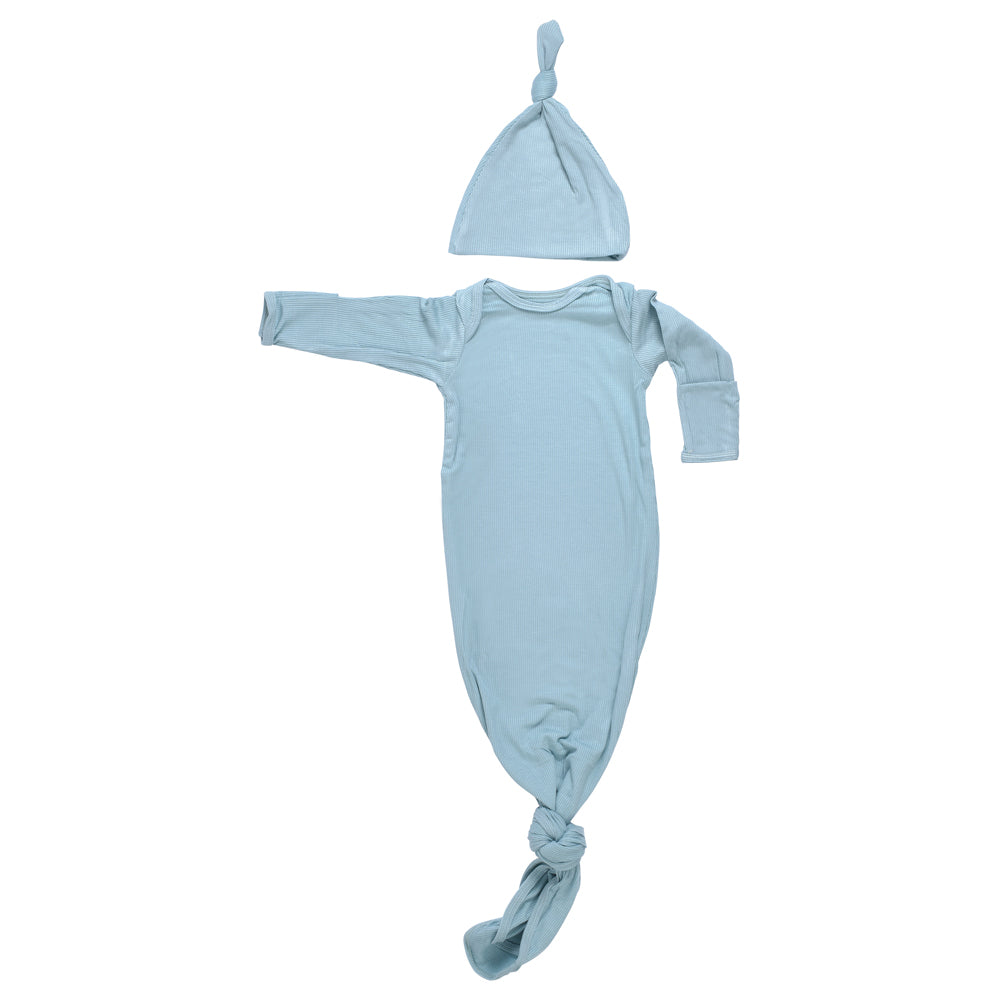 Designed for day or night, this tie-bottom outfit ensures easy diaper changes and gentle dressing.
