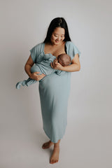 breastfeeding newborn in Three Little Tots matching blue bird labor gown and blue bird knotted baby gown