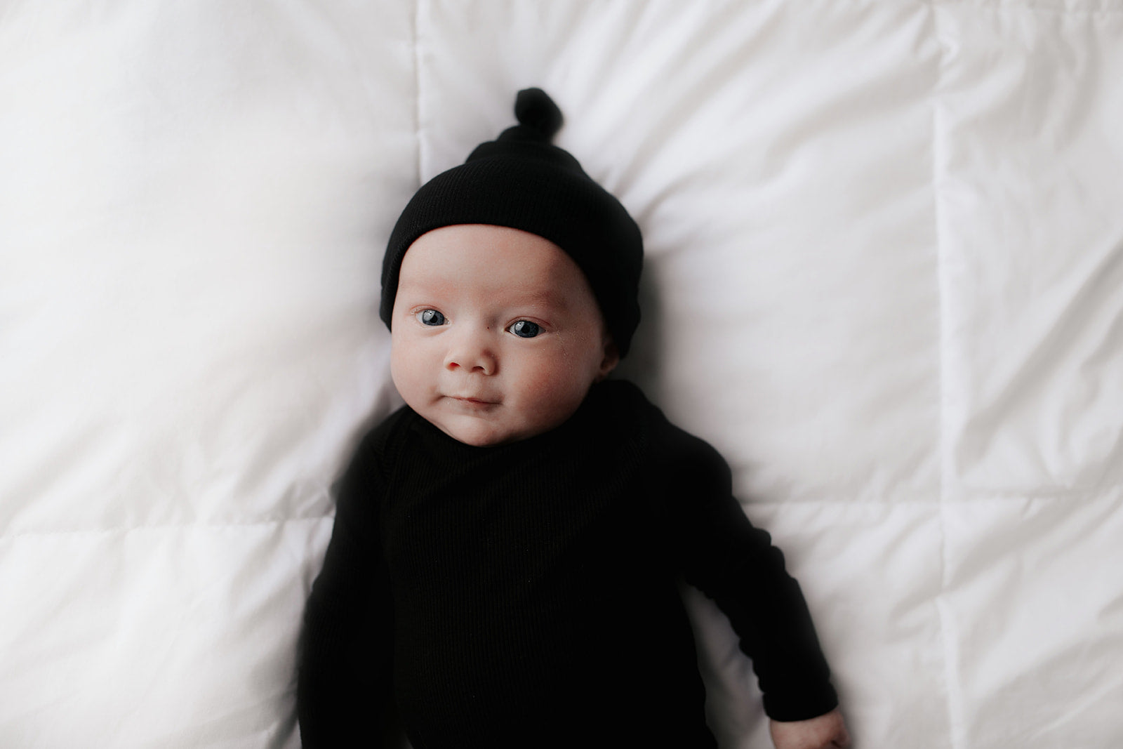 Ultra-soft baby gowns with tie bottom for quick diaper changes and easy pull-down shoulder tabs.