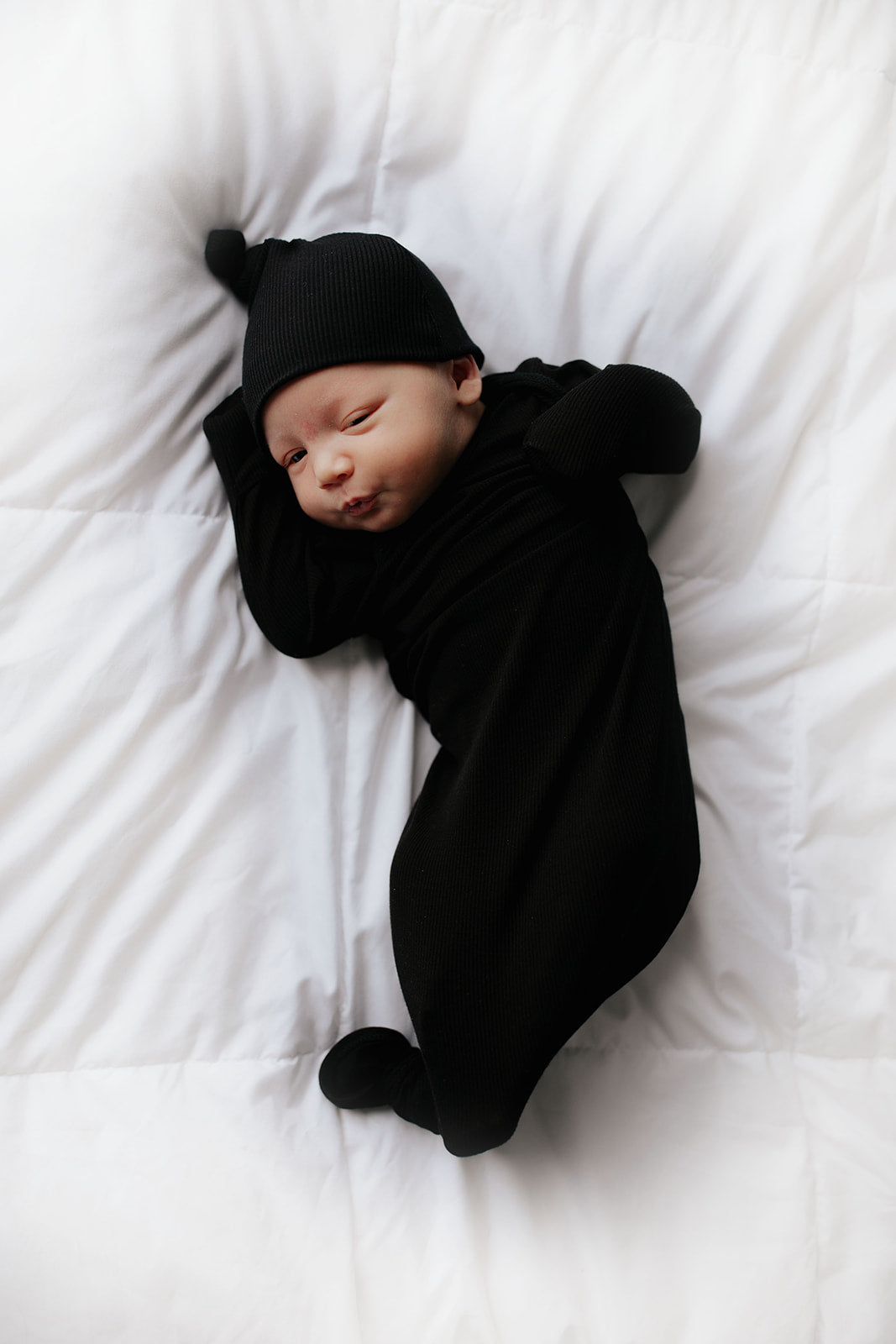 Ultra-soft baby gowns with tie bottom for quick diaper changes and easy pull-down shoulder tabs.