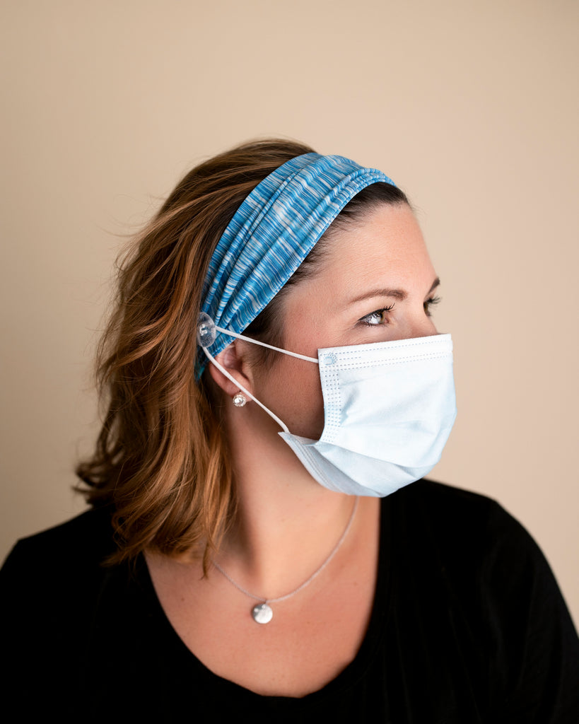 Comfortable headbands with button enclosure make mask-wearing easy for nurses on long shifts.