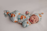 Ultra-soft Dinosaur baby gowns with stretchy fabric and tie bottom for easy night-time diaper changes.