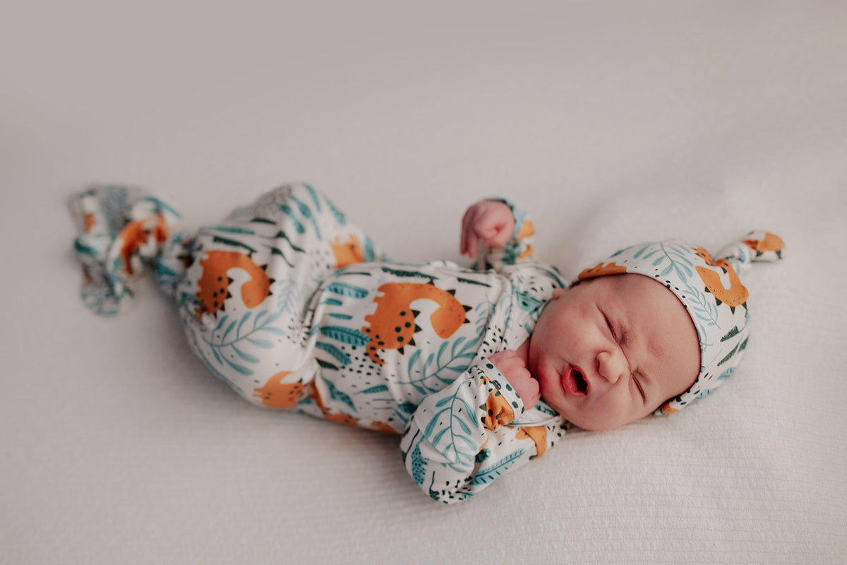 Ultra-soft Dinosaur baby gowns with stretchy fabric and tie bottom for easy night-time diaper changes.