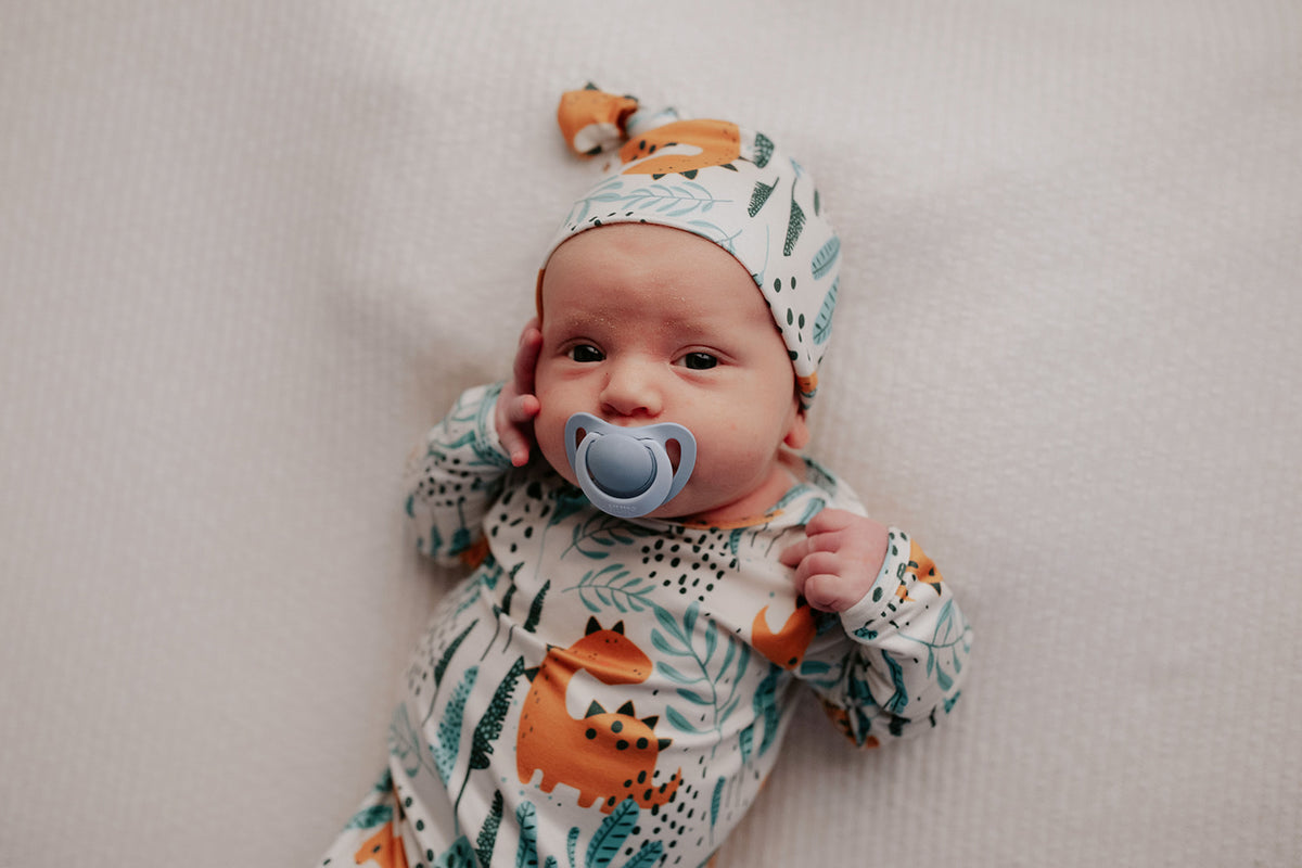 Ultra-soft Dinosaur baby gowns with stretchy fabric and tie bottom for easy night-time diaper changes.