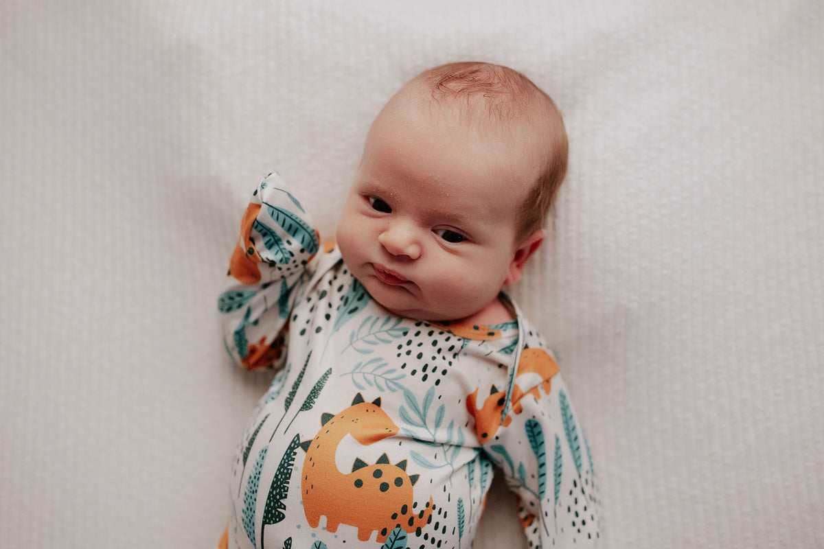 Ultra-soft Dinosaur baby gowns with stretchy fabric and tie bottom for easy night-time diaper changes.