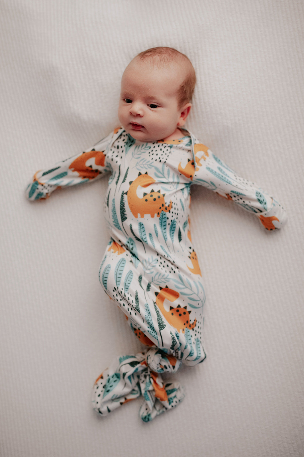 Ultra-soft Dinosaur baby gowns with stretchy fabric and tie bottom for easy night-time diaper changes.