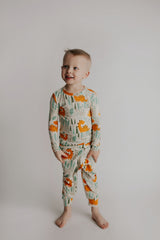 Toddler and big kid jammies in matching prints and solids, designed for comfy bedtime or lounging all day. Dinosaur themed Kids Pajamas.
