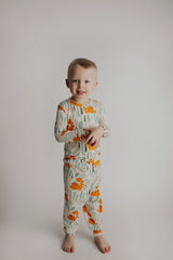 Toddler and big kid jammies in matching prints and solids, designed for comfy bedtime or lounging all day. Dinosaur themed Kids Pajamas.