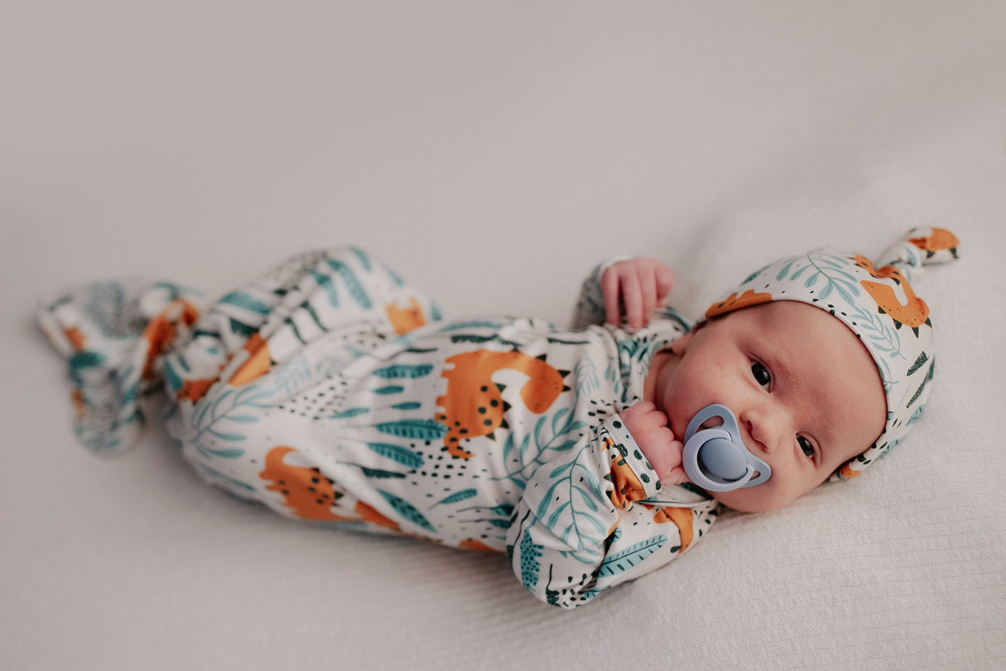 Ultra-soft Dinosaur baby gowns with stretchy fabric and tie bottom for easy night-time diaper changes.
