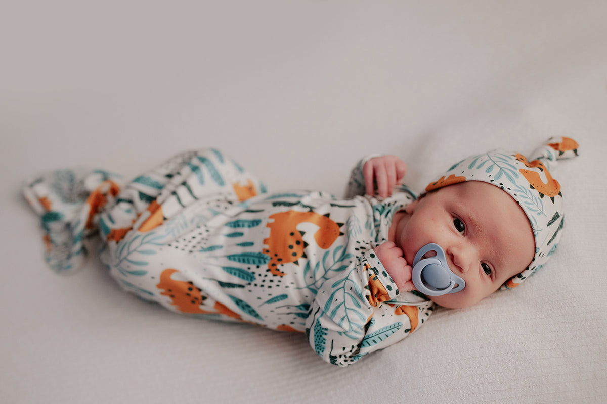 Ultra-soft Dinosaur baby gowns with stretchy fabric and tie bottom for easy night-time diaper changes.
