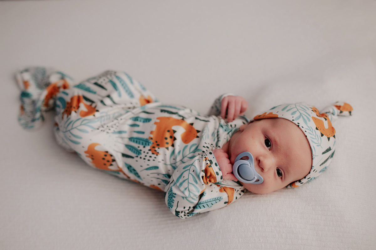Ultra-soft Dinosaur baby gowns with stretchy fabric and tie bottom for easy night-time diaper changes.