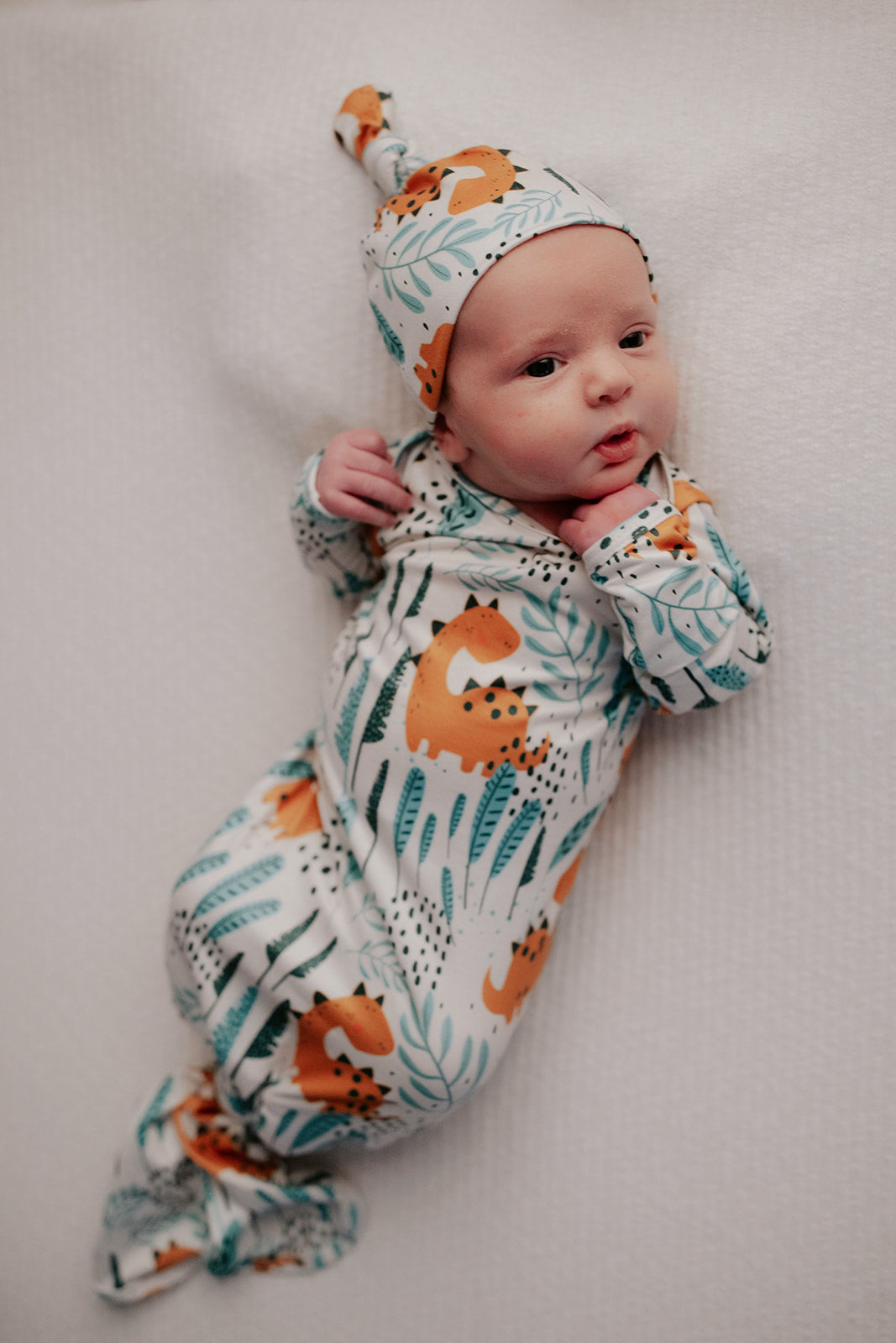 Ultra-soft Dinosaur baby gowns with stretchy fabric and tie bottom for easy night-time diaper changes.