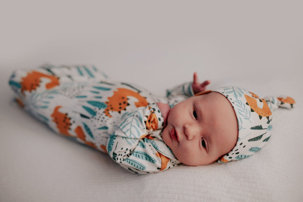 Ultra-soft Dinosaur baby gowns with stretchy fabric and tie bottom for easy night-time diaper changes.