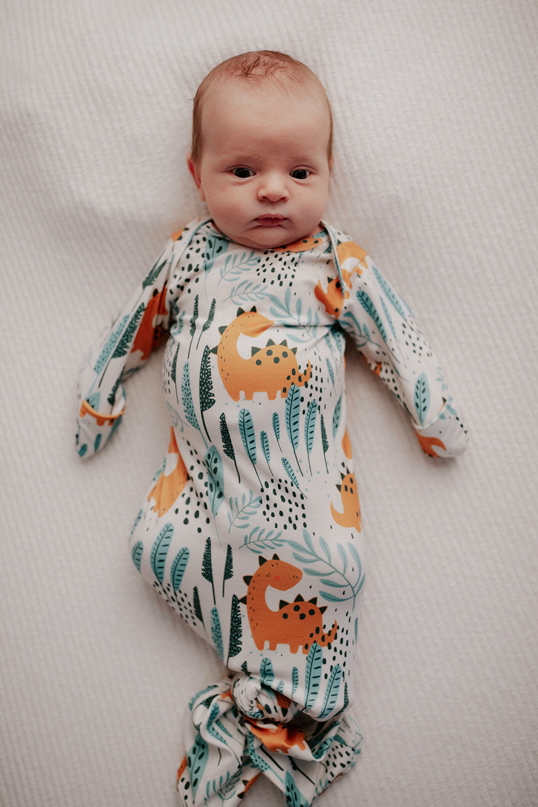 Ultra-soft Dinosaur baby gowns with stretchy fabric and tie bottom for easy night-time diaper changes.