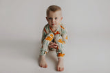 Toddler and big kid jammies in matching prints and solids, designed for comfy bedtime or lounging all day. Dinosaur themed Kids Pajamas.