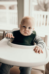 Designed in the USA, Three Little Tots food-grade silicone bibs with crumb catcher ensure comfort and cleanliness for your baby.