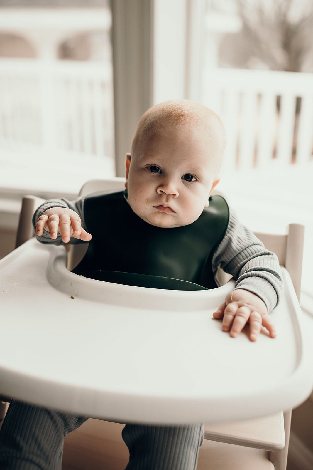 Designed in the USA, Three Little Tots food-grade silicone bibs with crumb catcher ensure comfort and cleanliness for your baby.