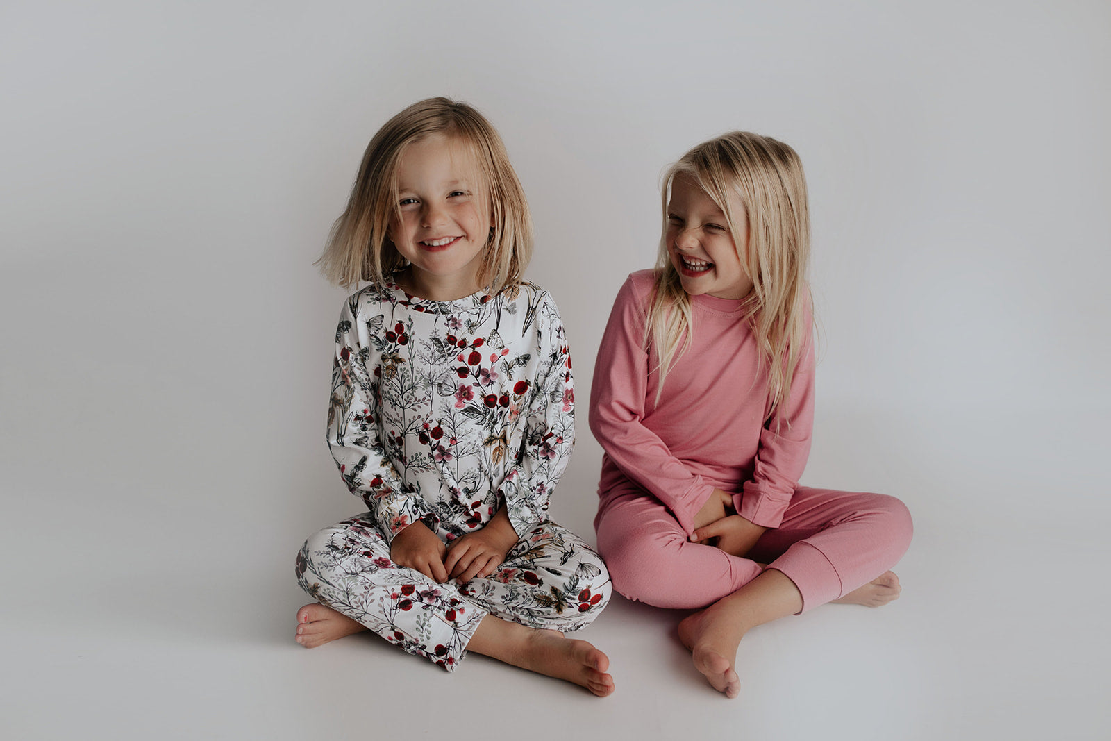 Twins as best friends wearing Three Little Tots Pajamas
