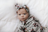 Super soft baby gowns with stretchy fabric, easy tie bottom for diaper changes, and pull-down tabs for dressing ease.