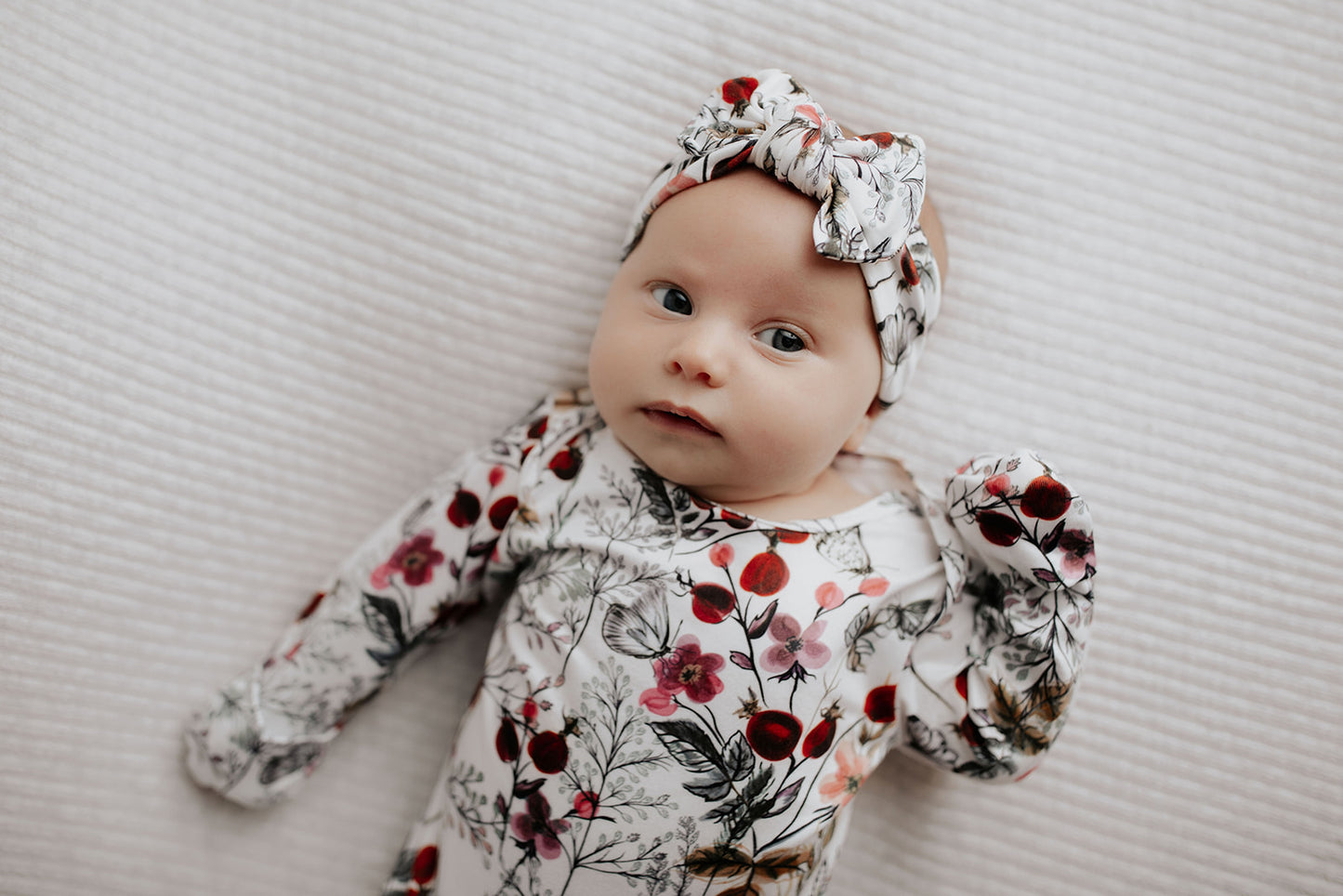 Comfort-focused baby gowns with soft, stretchy material and convenient pull-down tabs for quick dressing and changes.