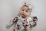 Comfort-focused baby gowns with soft, stretchy material and convenient pull-down tabs for quick dressing and changes.