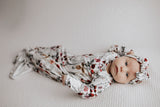 Super soft baby gowns with stretchy fabric, easy tie bottom for diaper changes, and pull-down tabs for dressing ease.