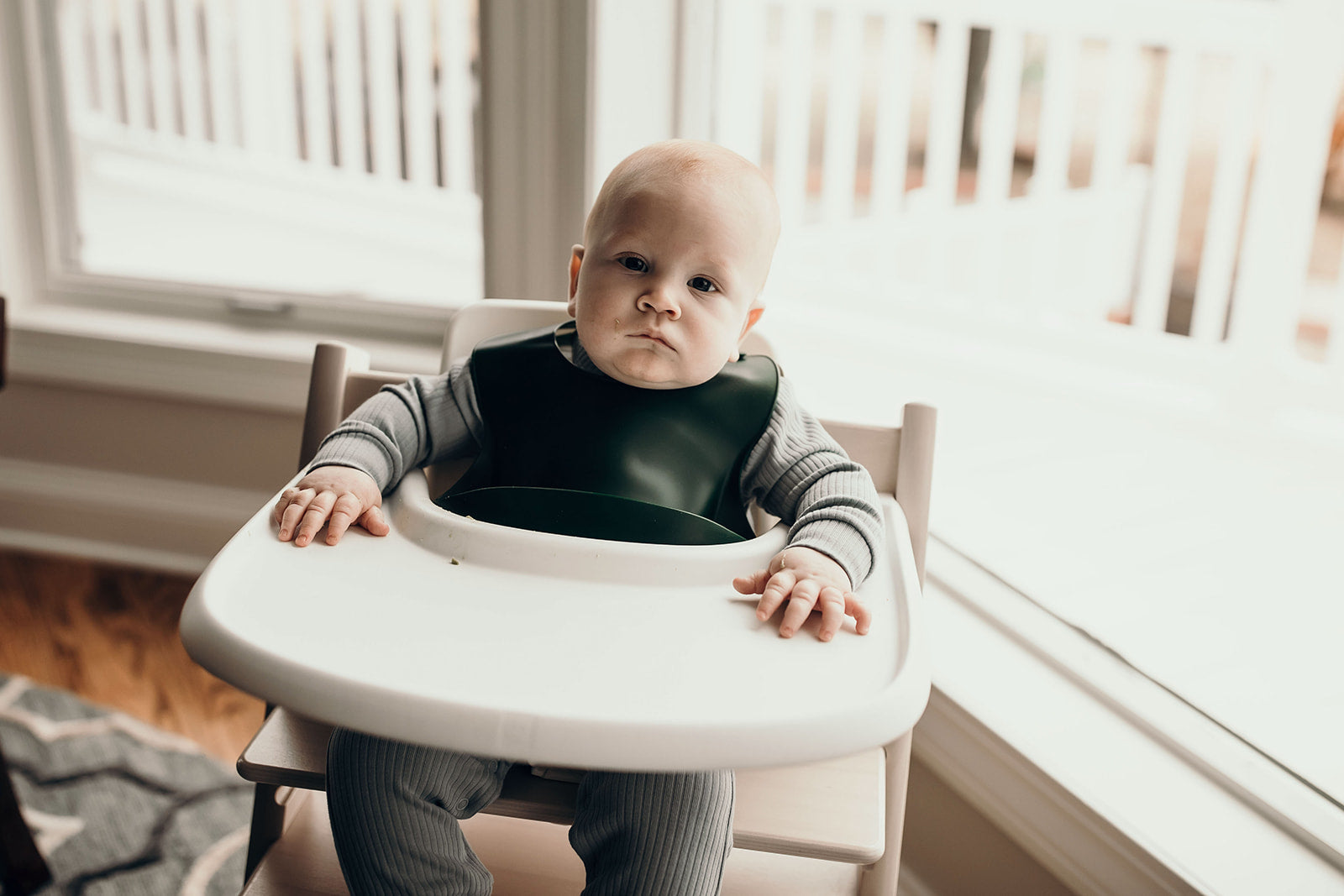 Designed in the USA, Three Little Tots food-grade silicone bibs with crumb catcher ensure comfort and cleanliness for your baby.