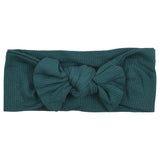 Hand-tied and made with love. Our popular buttery soft and stretchy knotted headbands are perfect for your little girl!