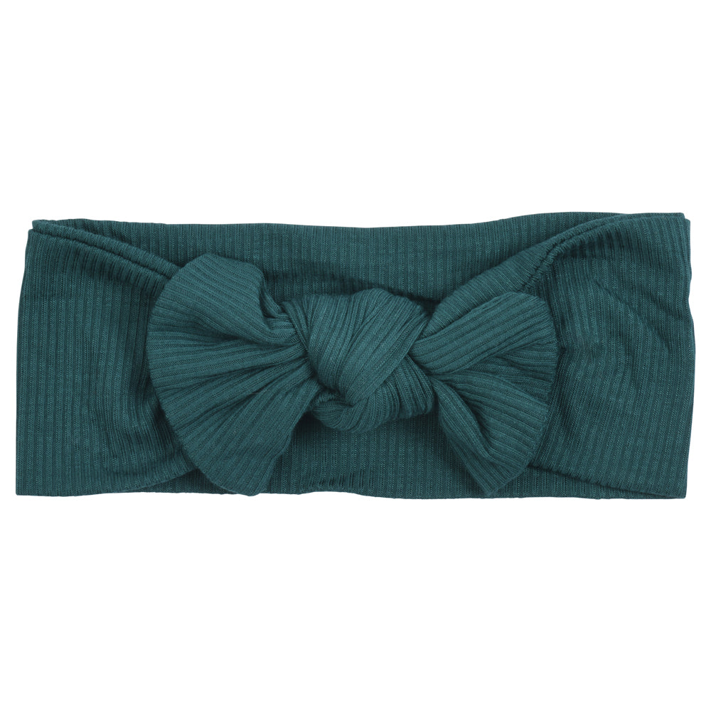 Hand-tied and made with love. Our popular buttery soft and stretchy knotted headbands are perfect for your little girl!
