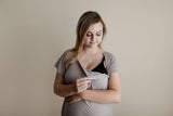 Snaps down the front of the Three Little Tots labor gown allow the gown to be put on and off over the IVs. 