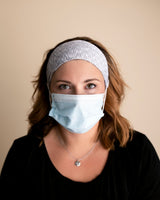 Comfortable headbands with button enclosure make mask-wearing easy for nurses on long shifts.