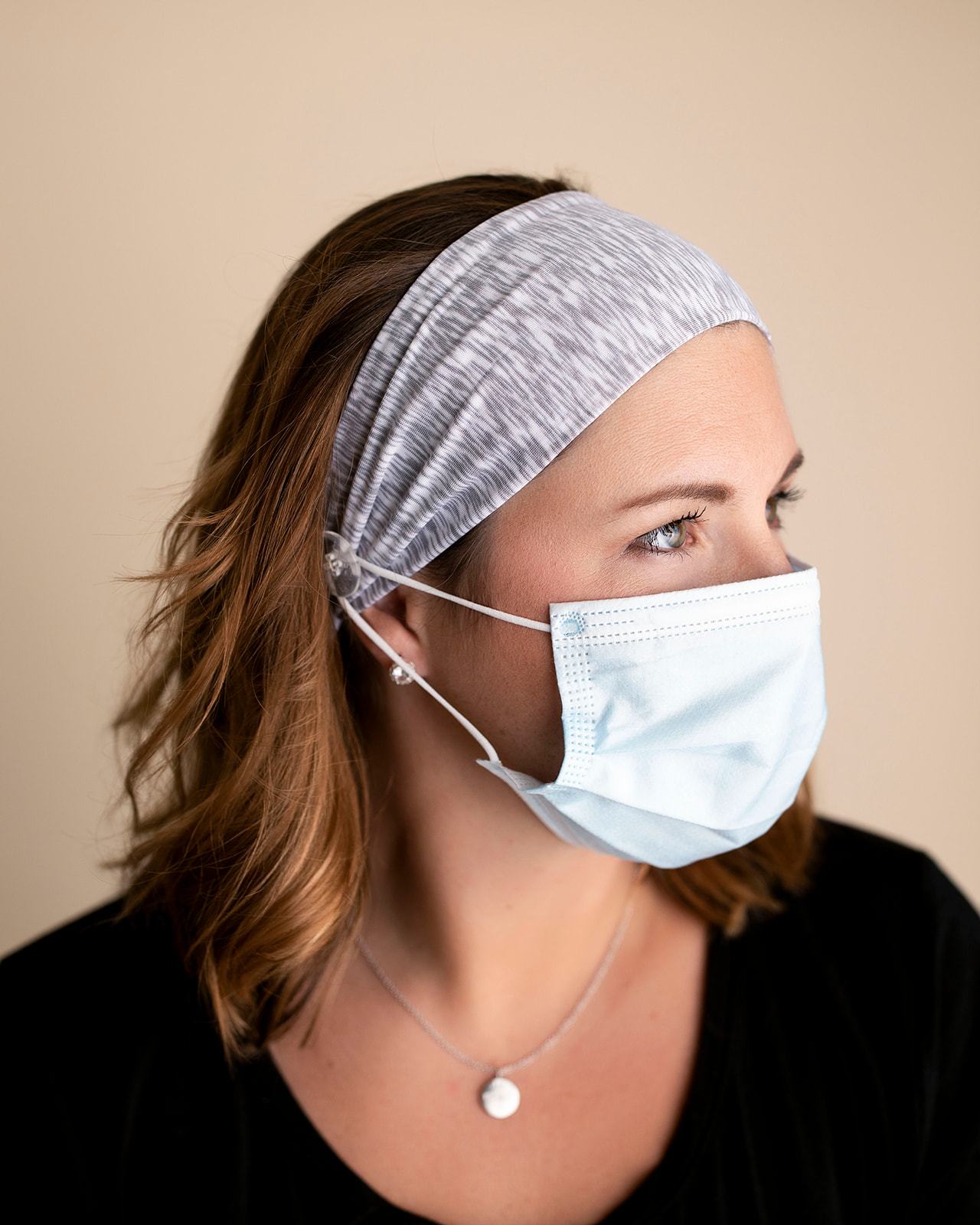 Comfortable headbands with button enclosure make mask-wearing easy for nurses on long shifts.