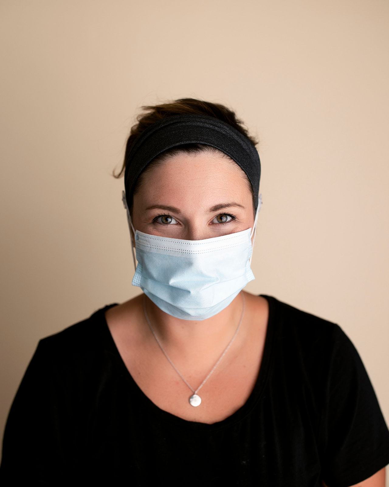 Comfortable headbands with button enclosure make mask-wearing easy for nurses on long shifts.