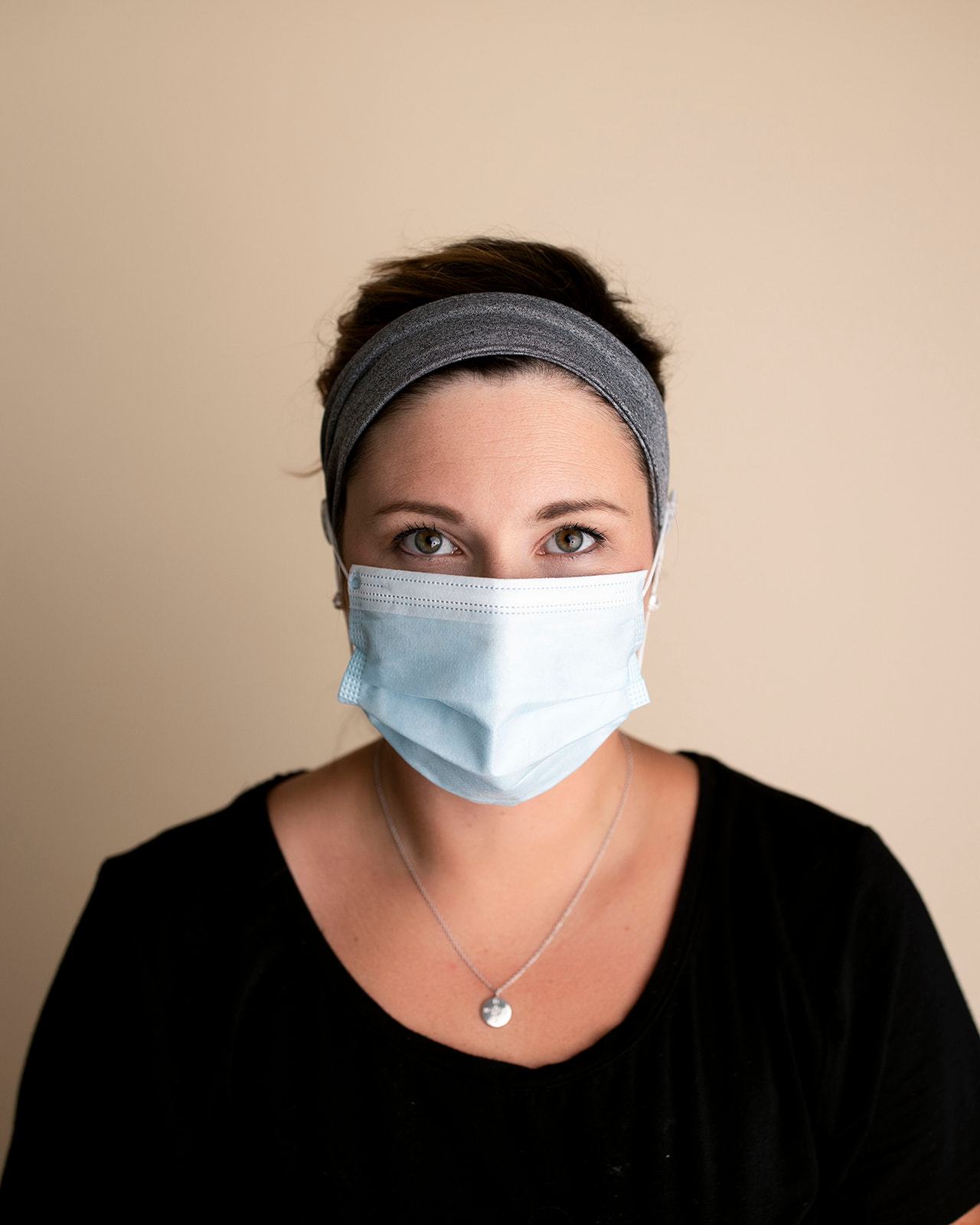 Comfortable headbands with button enclosure make mask-wearing easy for nurses on long shifts.