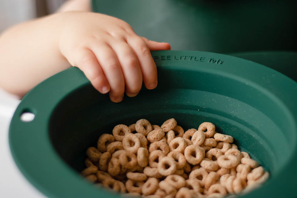 Travel-friendly silicone bowls with double grips, making snack time and cleanup a breeze for moms.