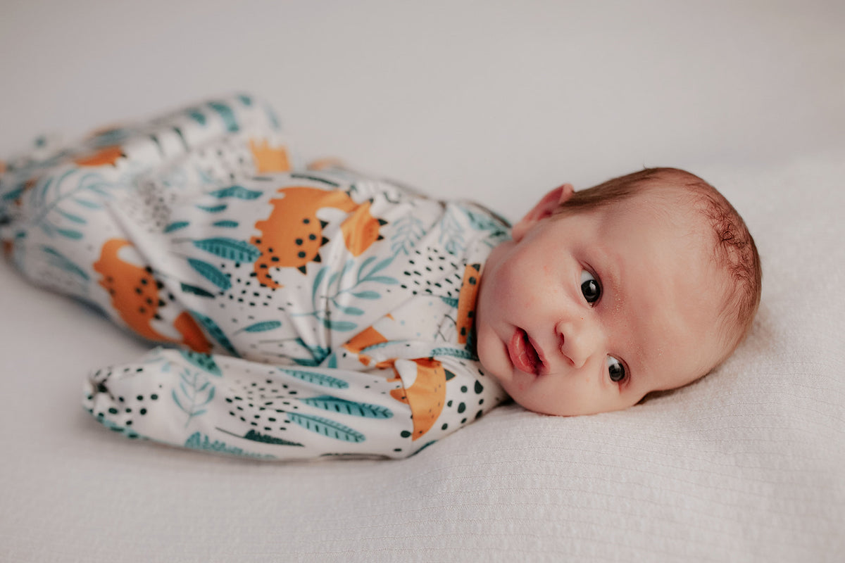 Ultra-soft Dinosaur baby gowns with stretchy fabric and tie bottom for easy night-time diaper changes.