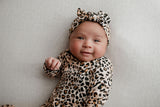 A newborn photoshoot idea with the Leopard Three Little Tots knotted baby gown with a cute bow.