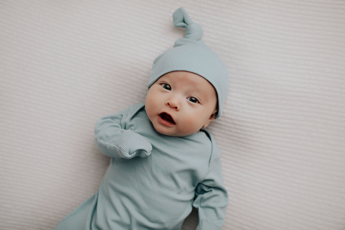 newborn baby photoshoot with a baby boy welcome home outfit