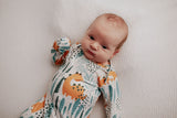 Ultra-soft Dinosaur baby gowns with stretchy fabric and tie bottom for easy night-time diaper changes.