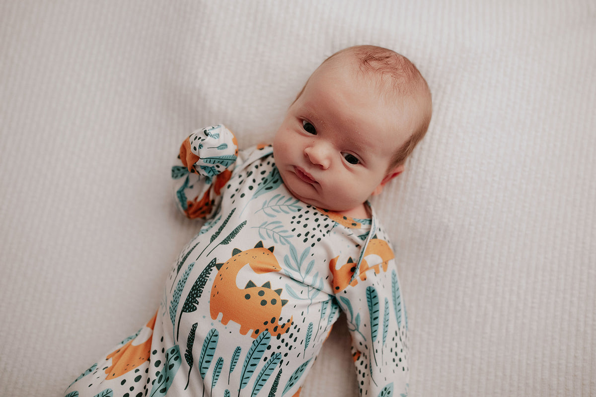 Ultra-soft Dinosaur baby gowns with stretchy fabric and tie bottom for easy night-time diaper changes.