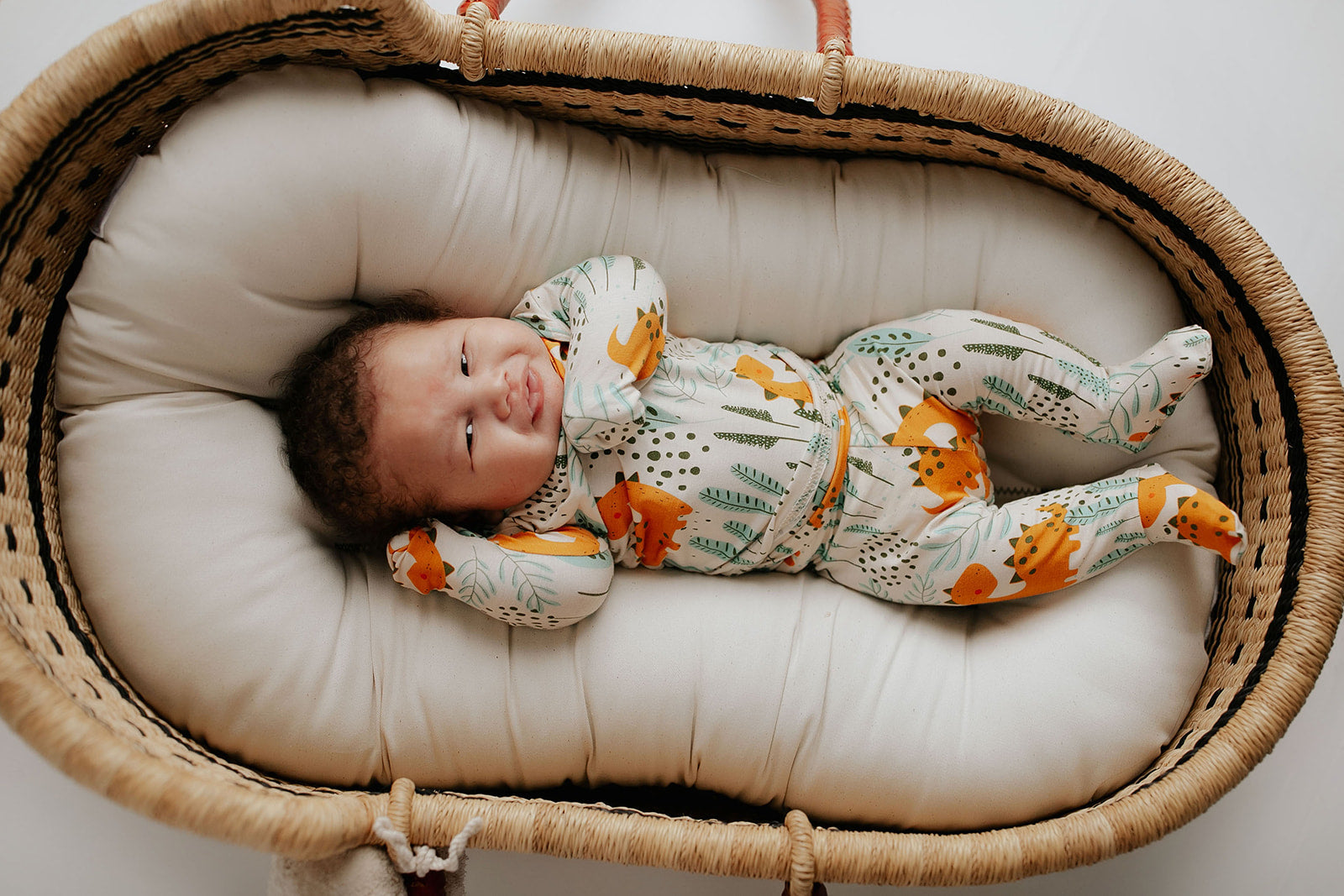 Toddler and big kid jammies in matching prints and solids, designed for comfy bedtime or lounging all day. Snuggle Me organics in a Plum + Sparrow Moses Basket