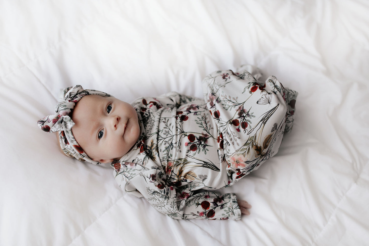 Comfort-focused baby gowns with soft, stretchy material and convenient pull-down tabs for quick dressing and changes.